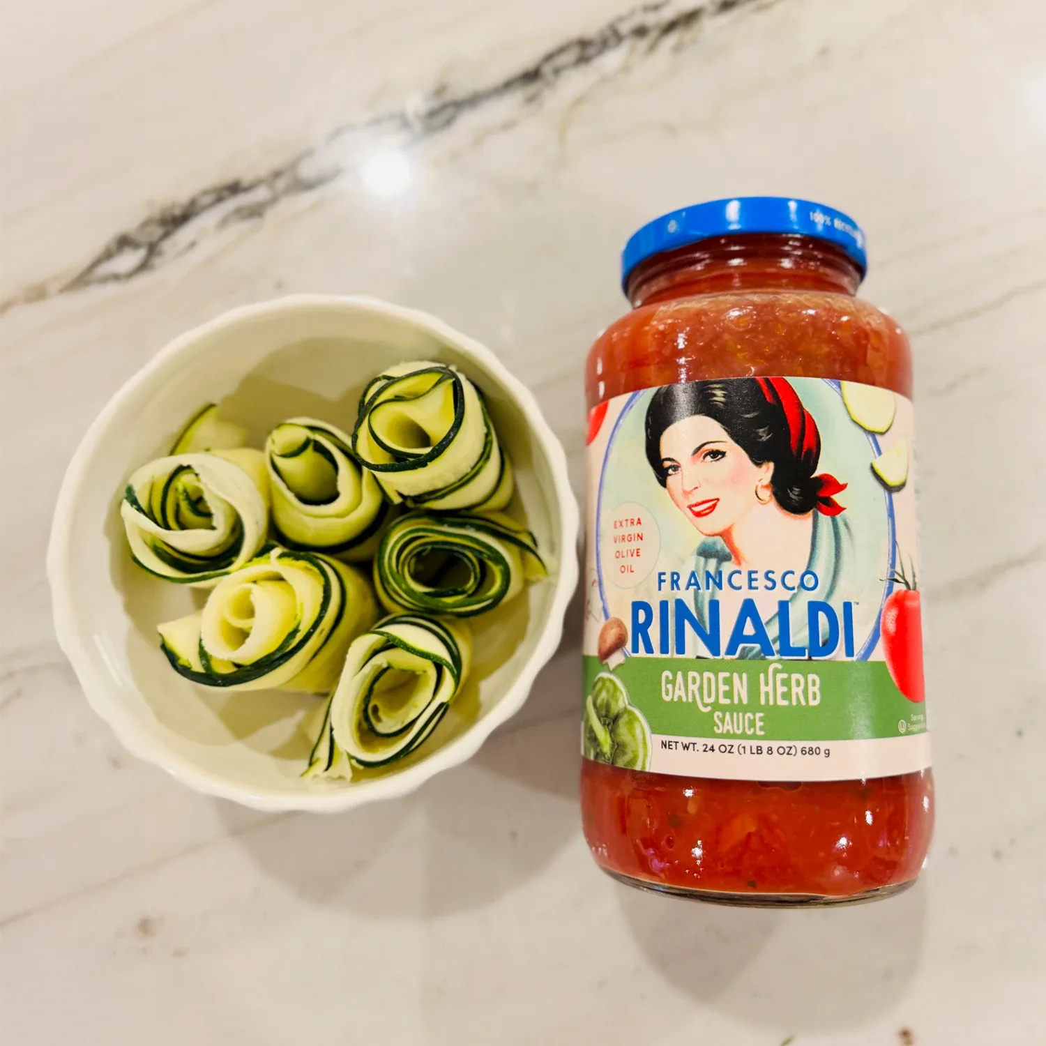 Jar of Francesco Rinaldi Garden Herb Sauce with zucchini ribbons.
