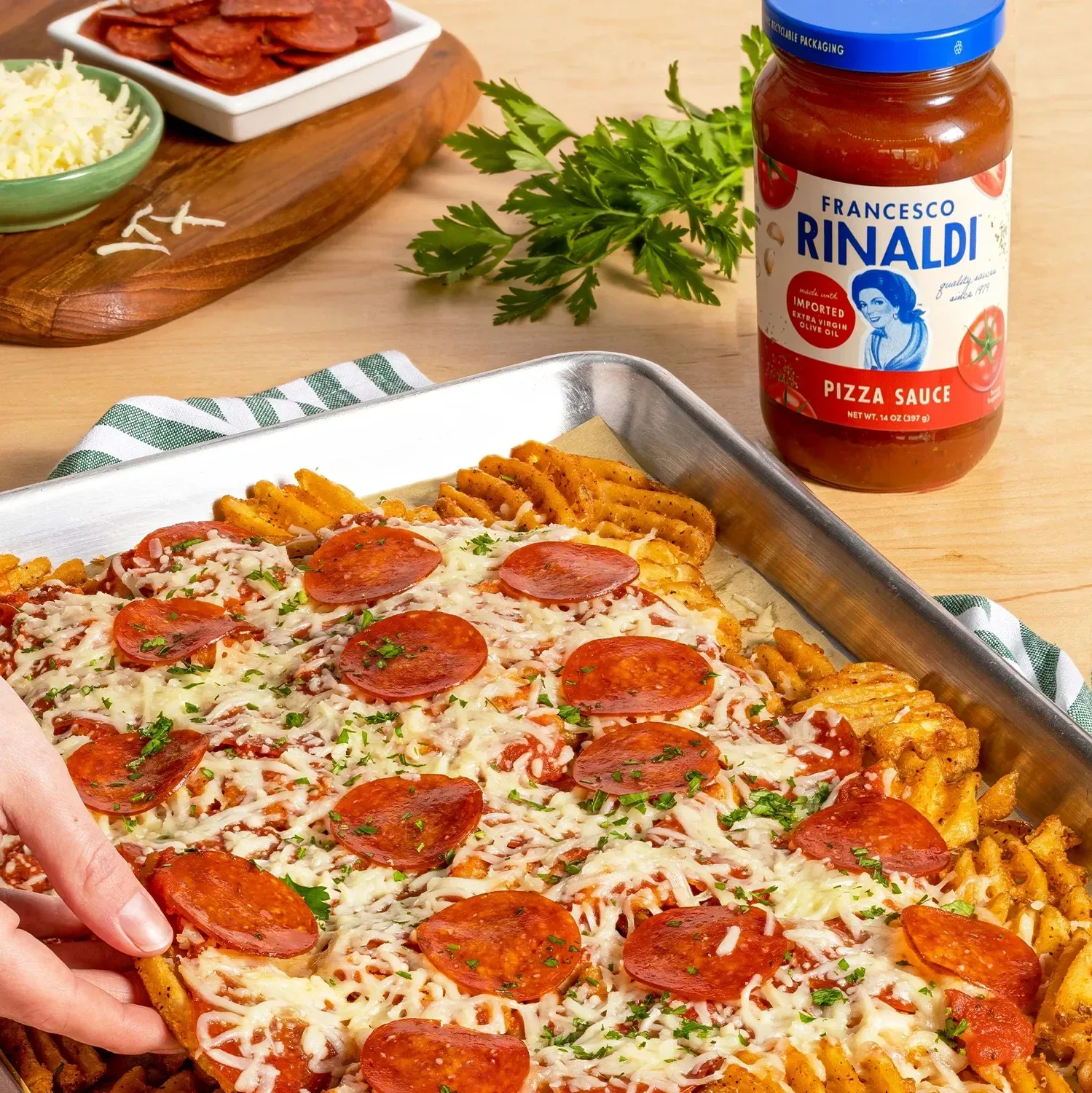 Pull-apart sheet of waffle fries baked with red sauce, cheese, and pepperoni.